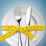 Plate and utenstils with measuring tape wrapped around - Habits To Start Your Weight Loss Journey