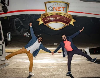 Hard Work Pays, Qnet’s Achievers Are The Proof! 7 2 men standing in front of qnet achievers plane