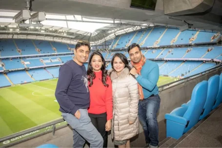 Hard Work Pays, Qnet’s Achievers Are The Proof! 8 people standing at manchester city football stadium