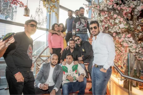 Hard Work Pays, Qnet’s Achievers Are The Proof! 6 QNET members sitting on stairs