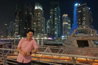 Michael Dovinno in front of city