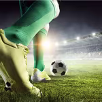 image of football player on the field about to kick a ball