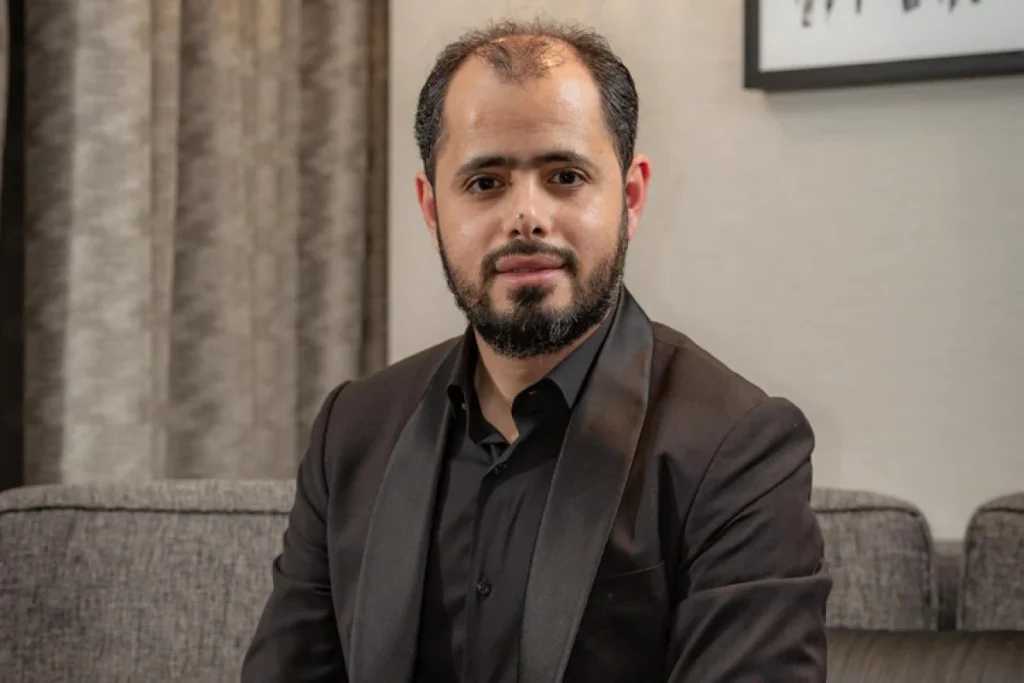 Omar Alhallak posing