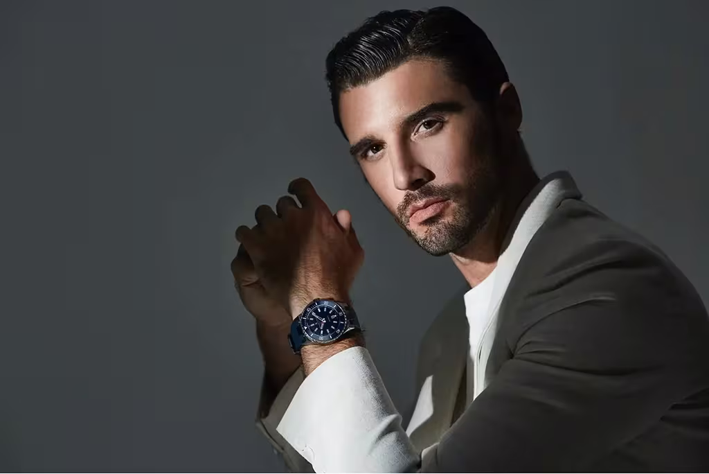 5 Things Your Bernhard H. Mayer Swiss Watch Says About You 6 Man wearing Bernard h mayer watch in a white suit