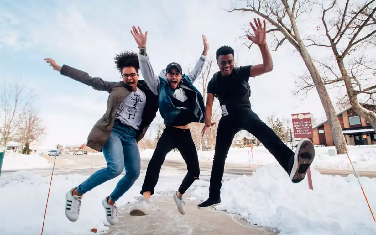 3 people jumping in the air