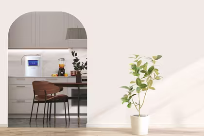 An inviting kitchen scene, complete with greenery, a dining area, fresh orange juice, and HomePure Viva, promoting a healthy kitchen lifestyle.