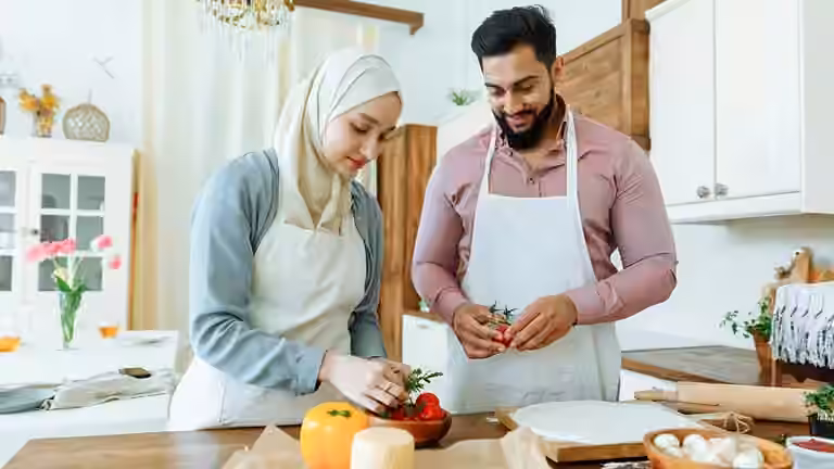 Man and woman preparing food for Ramadan