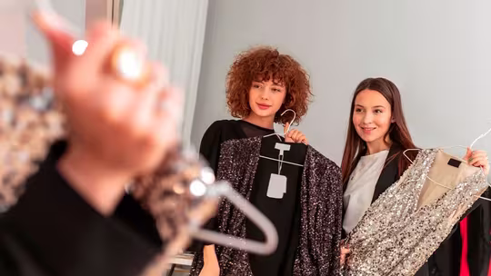 women showing dresses on a clothes hanger omni watch
