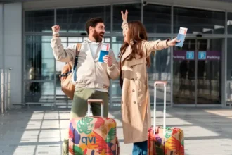 Couple excited to escape winter season by going on a budget-friendly package holiday, which they booked through QVI Vacay
