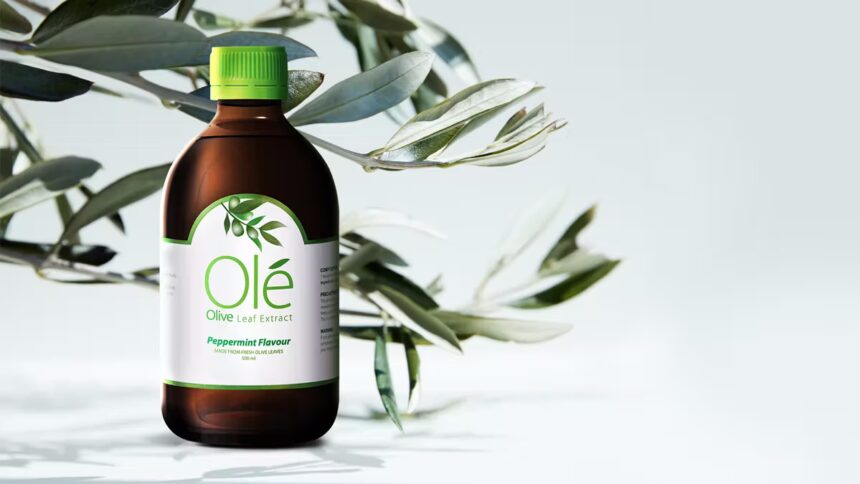 Bottle of Ole Olive Leaf Extract in front of olive leaves