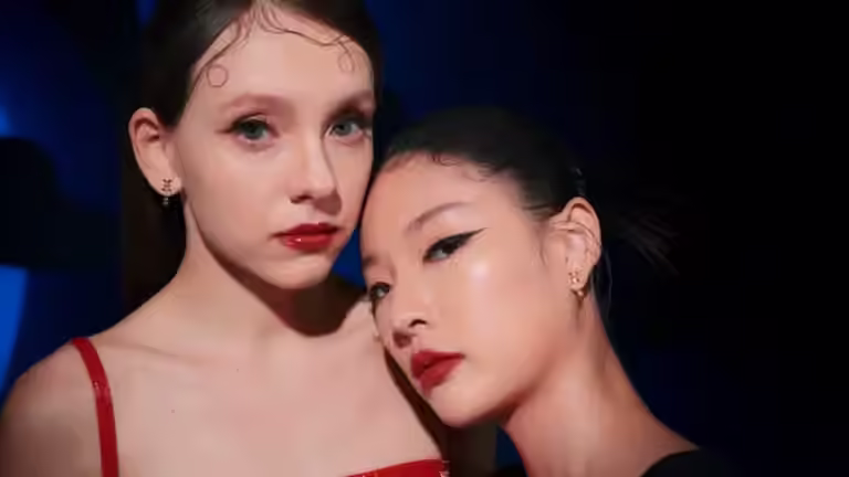 Two models posing with Bernhard H Mayer Insignia Collection