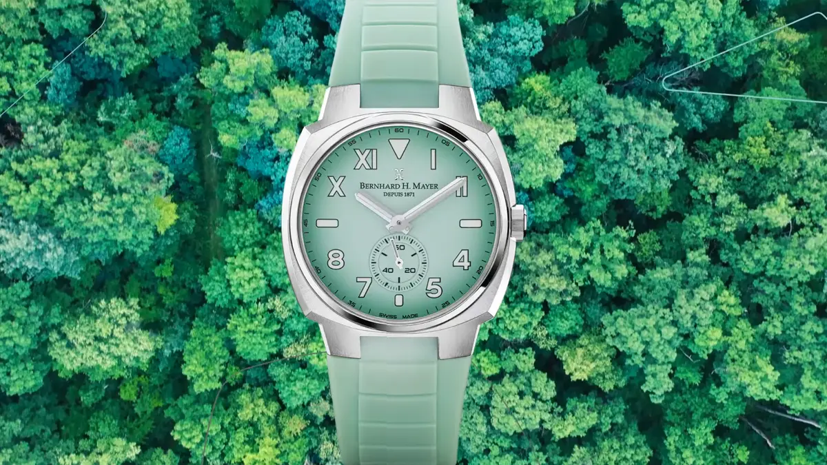 Understanding The Different Mechanisms, Tech And Materials In Bernhard H. Mayer Watches 5 Green OMNI watch displayed above a top view image of trees