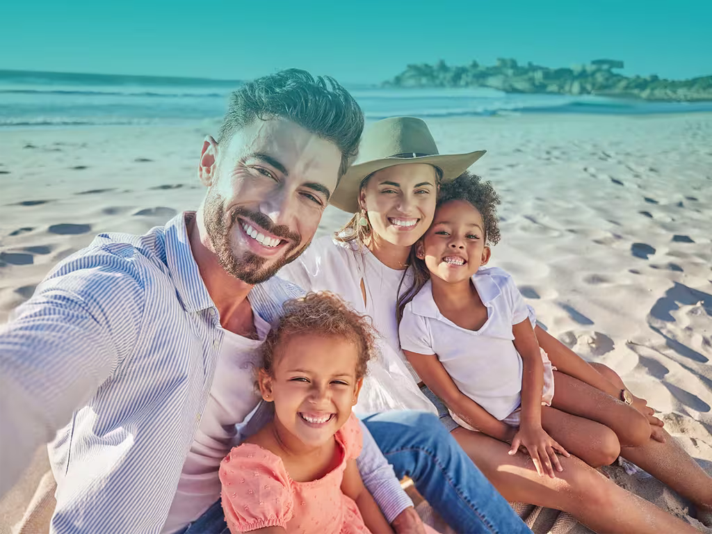 Family at the beach qvi vacay