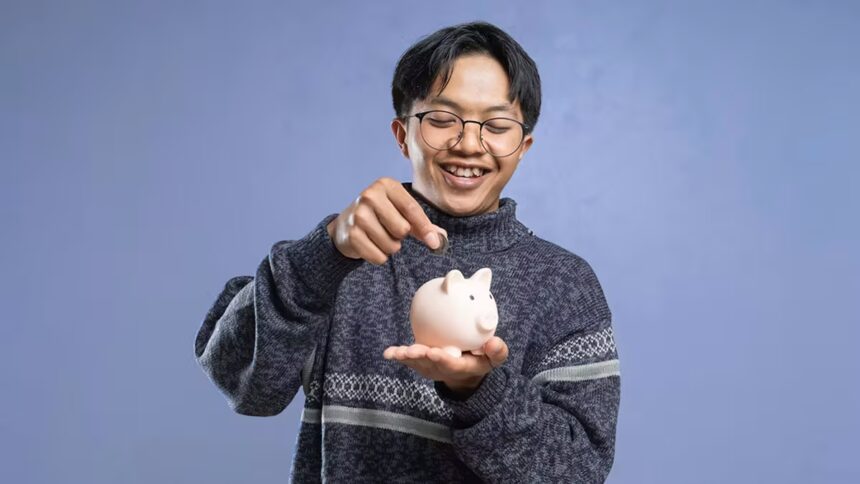Guy symbolically saving his QNET earnings in a piggy bank