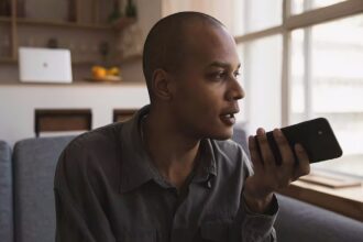 Man recording a voice message and wondering is the middle class the new poor