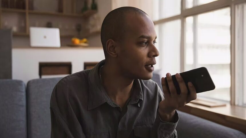 Man recording a voice message and wondering is the middle class the new poor