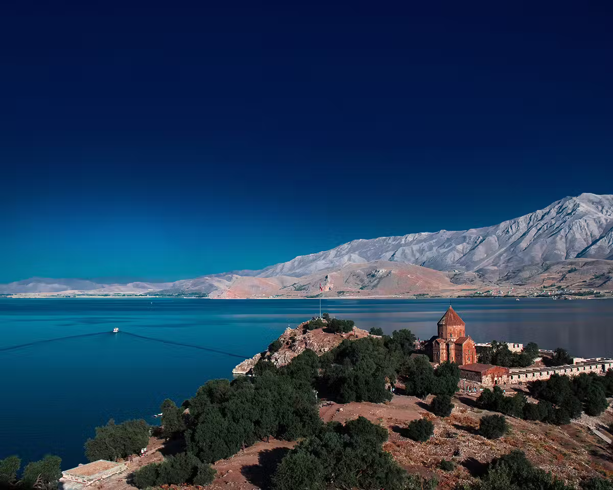 Five Must-Visit Lake Destinations For Your Travel Bucket List 6 A monastery on Akdamar Island in one of the best lakes to visit around the world, Lake Van, Turkiye.