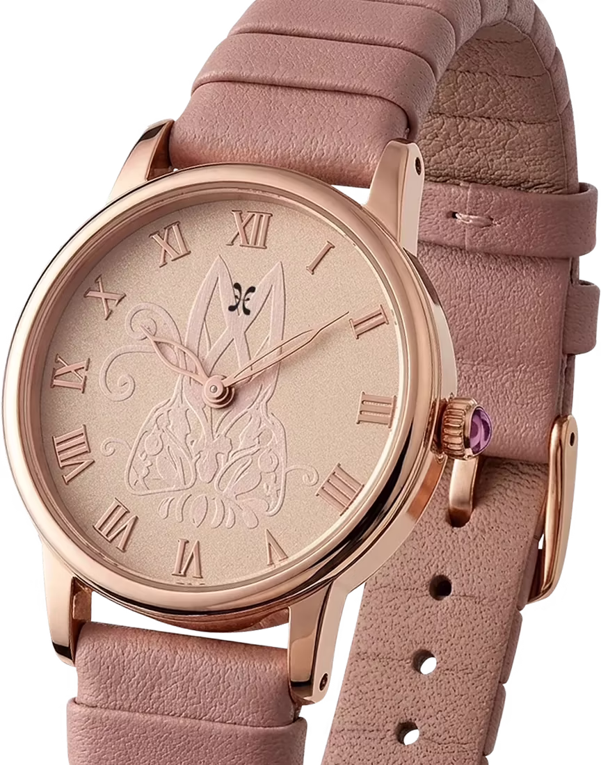 Velora, the winning watch: rose-gold case, blush dial with a moth motif and Roman numerals, pink leather strap